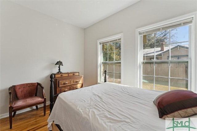 bedroom with wood-type flooring