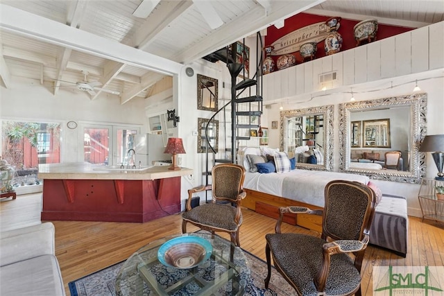 bedroom with sink, high vaulted ceiling, light wood-type flooring, beamed ceiling, and white fridge