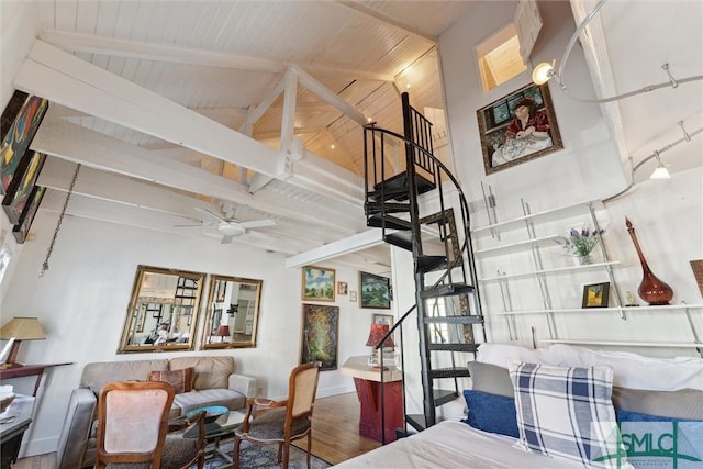 interior space with hardwood / wood-style flooring, ceiling fan, beam ceiling, high vaulted ceiling, and wooden ceiling