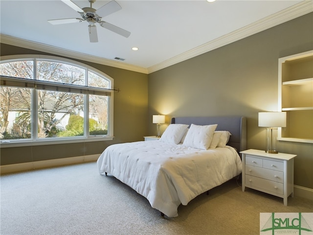 bedroom featuring crown molding, light carpet, and ceiling fan