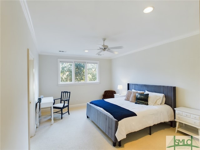 carpeted bedroom featuring ceiling fan and ornamental molding