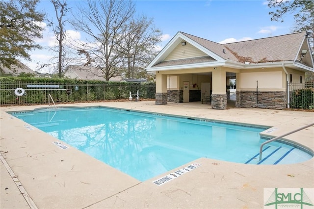 view of swimming pool featuring a patio