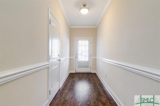 doorway with crown molding and dark hardwood / wood-style flooring