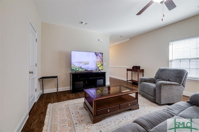 living room with wood-type flooring and ceiling fan