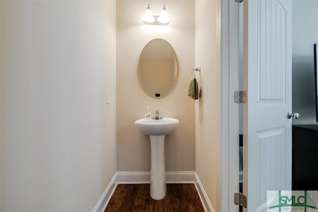 bathroom with hardwood / wood-style floors