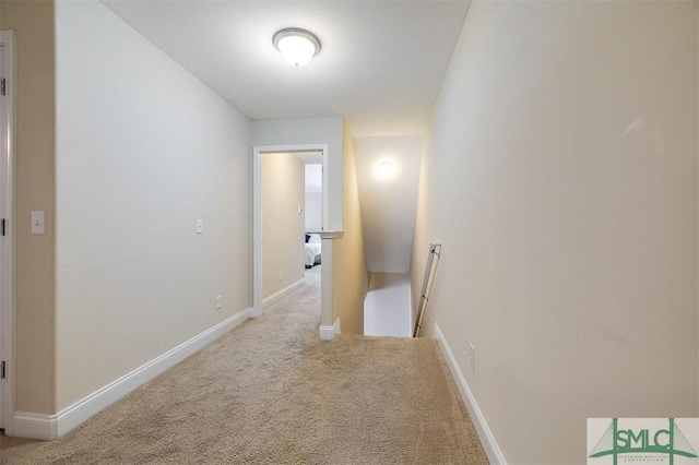 hallway with light colored carpet