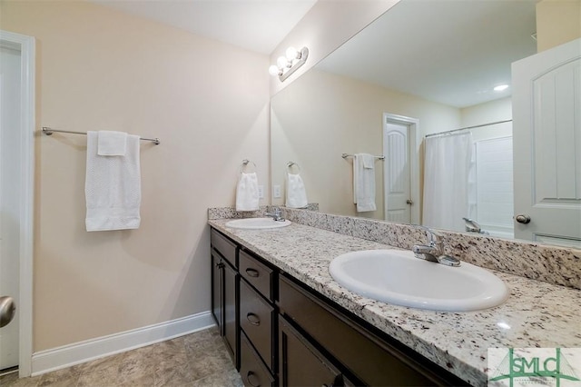 bathroom with vanity and curtained shower