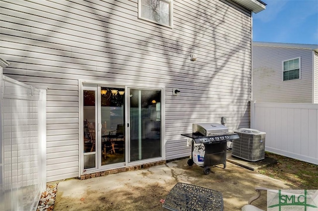 view of patio with grilling area and central air condition unit