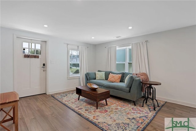 living room with light hardwood / wood-style floors