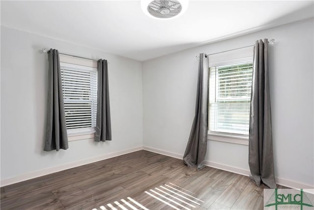 unfurnished room featuring hardwood / wood-style floors