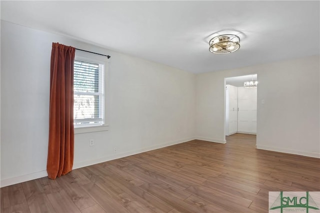 unfurnished room featuring light wood-type flooring