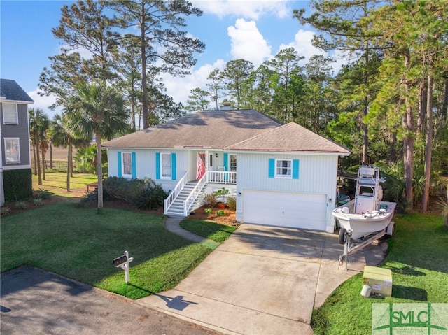 view of front of property featuring a garage and a front lawn