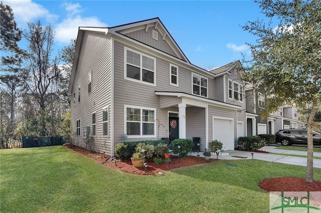 view of front of house with a garage and a front lawn