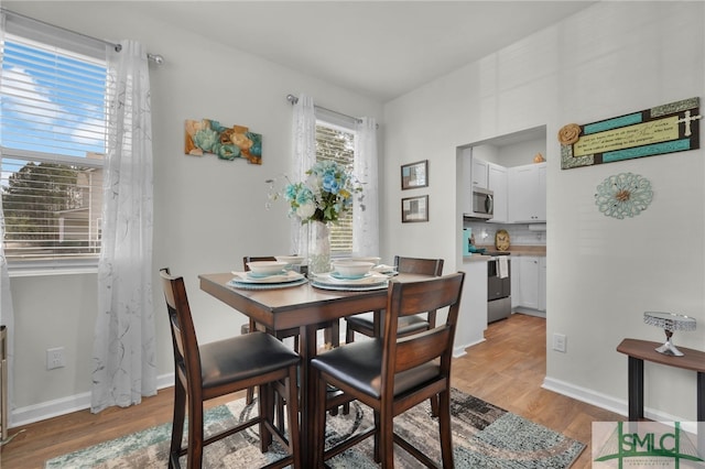 dining area featuring light hardwood / wood-style flooring