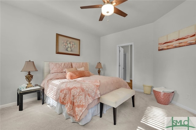 bedroom with ceiling fan and light colored carpet