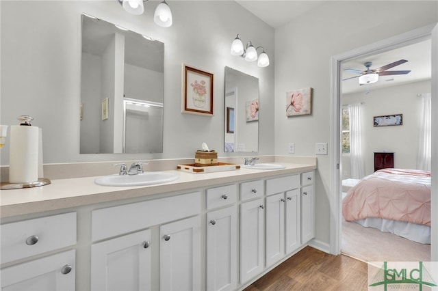 bathroom with vanity, hardwood / wood-style flooring, and ceiling fan