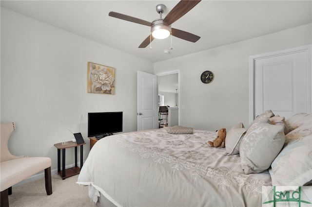 bedroom featuring light colored carpet and ceiling fan