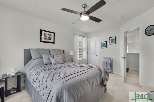 bedroom with light carpet and ceiling fan