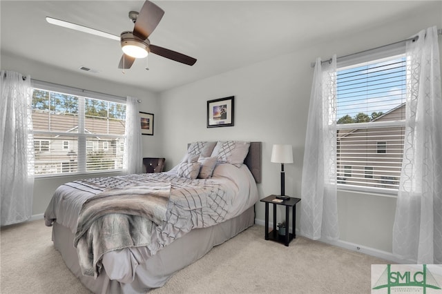 carpeted bedroom with ceiling fan