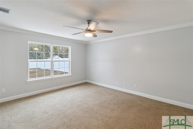 carpeted empty room with crown molding, ceiling fan, and a textured ceiling