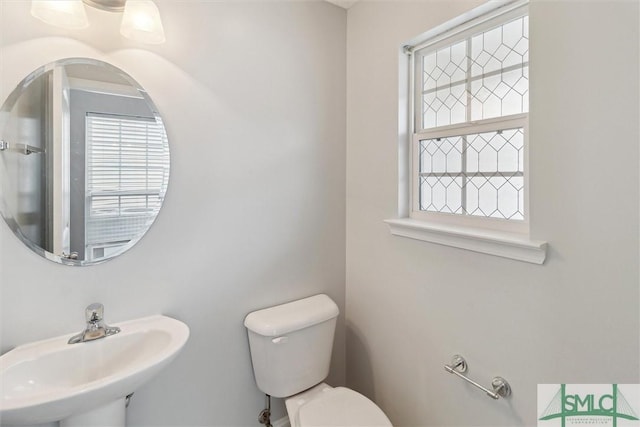 bathroom featuring sink and toilet