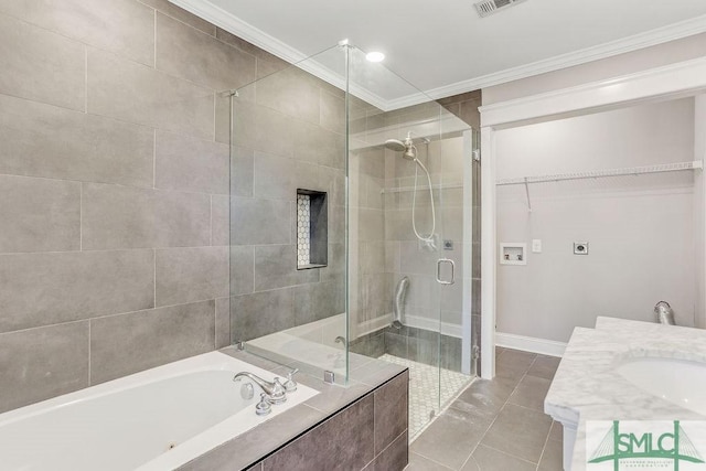 bathroom featuring tile patterned floors, ornamental molding, plus walk in shower, and vanity