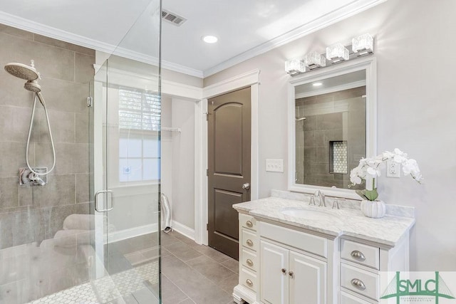 bathroom with walk in shower, tile patterned floors, vanity, and crown molding