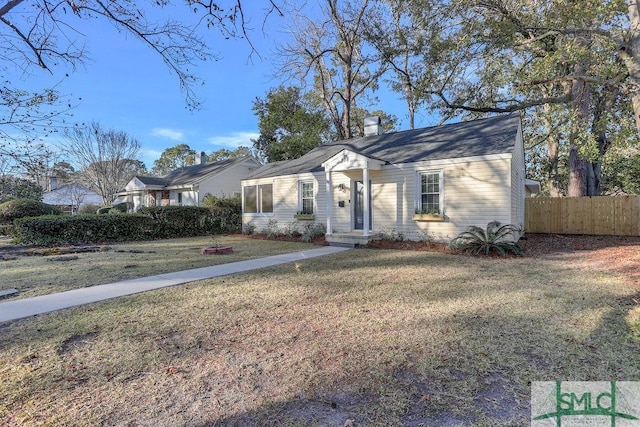 single story home with a front lawn