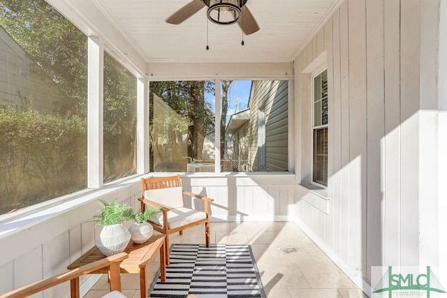 sunroom / solarium with ceiling fan