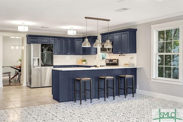 kitchen with blue cabinetry, decorative light fixtures, a kitchen breakfast bar, kitchen peninsula, and stainless steel appliances