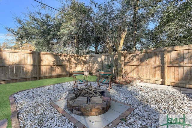 view of patio / terrace with an outdoor fire pit