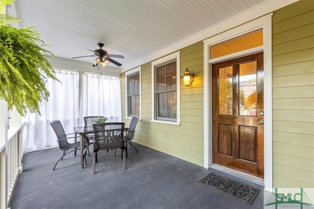 sunroom / solarium with ceiling fan