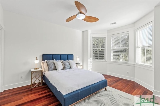 bedroom with dark wood-type flooring and ceiling fan