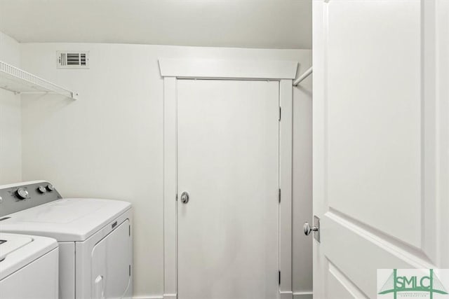 washroom featuring separate washer and dryer