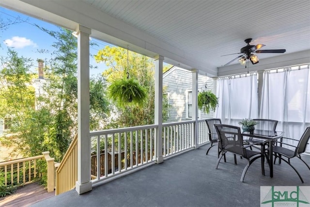 sunroom featuring ceiling fan