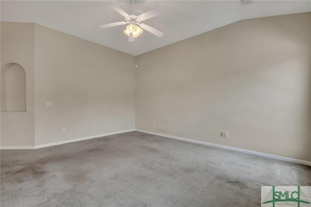 carpeted spare room featuring ceiling fan and lofted ceiling