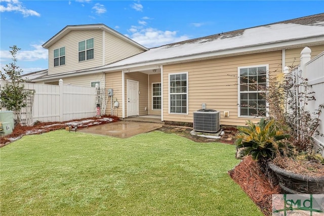 back of property featuring a patio, a yard, and central air condition unit