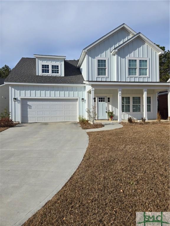 view of front of property featuring a garage and covered porch