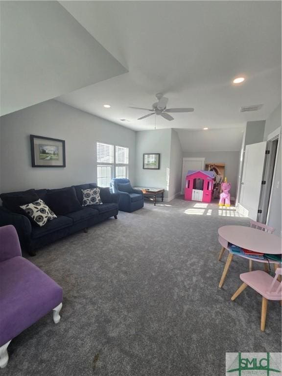 living room featuring ceiling fan and dark carpet