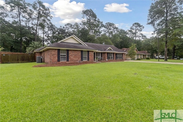 view of front facade with central AC and a front lawn