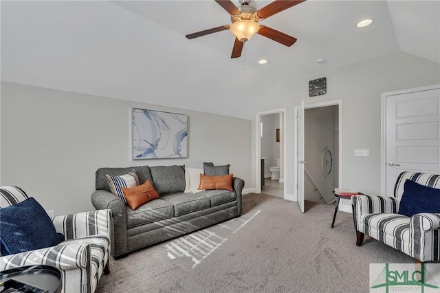 living room with light carpet, vaulted ceiling, and ceiling fan