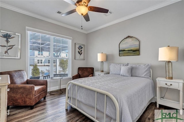 bedroom with crown molding, dark hardwood / wood-style floors, and ceiling fan