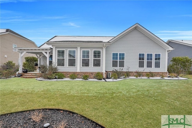 back of property featuring a pergola and a lawn