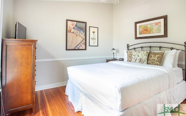 bedroom with wood-type flooring