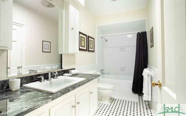 full bathroom featuring vanity, crown molding, shower / bath combination with curtain, and toilet