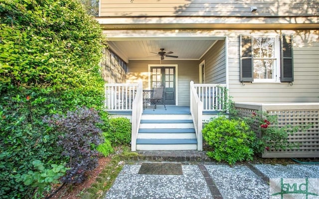 property entrance featuring covered porch and ceiling fan