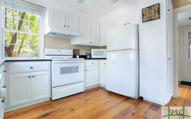 kitchen with white cabinetry, white appliances, a wealth of natural light, and light wood-type flooring