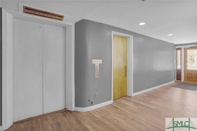 entrance foyer featuring wood-type flooring