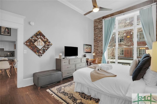 bedroom featuring multiple windows, ornamental molding, dark hardwood / wood-style floors, and ceiling fan