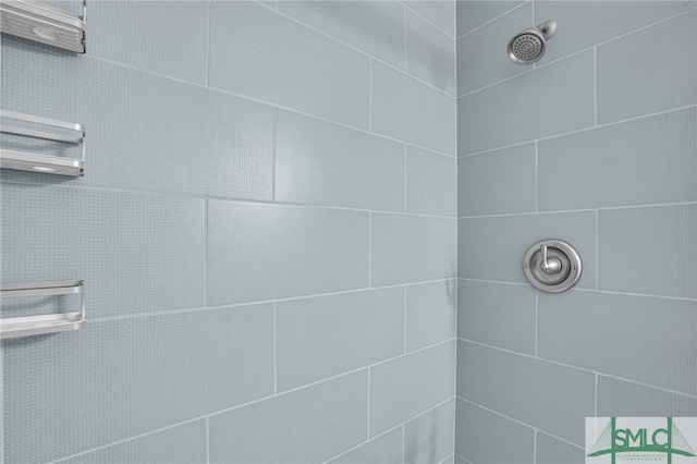 bathroom with a tile shower